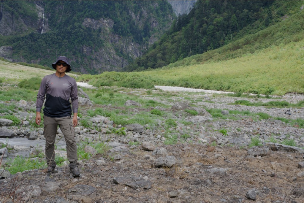 Trekker in a mountain valley landscape
