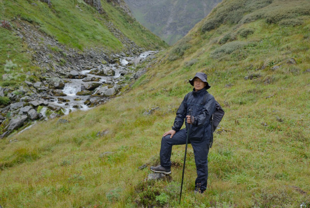 Trekker in a rocky valley trail